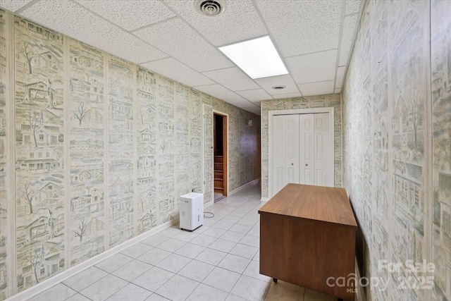 460 27th Avenue Cir NW, Hickory, NC 28601 - hallway with a paneled ceiling, baseboards, wallpapered walls, and light tile patterned floors