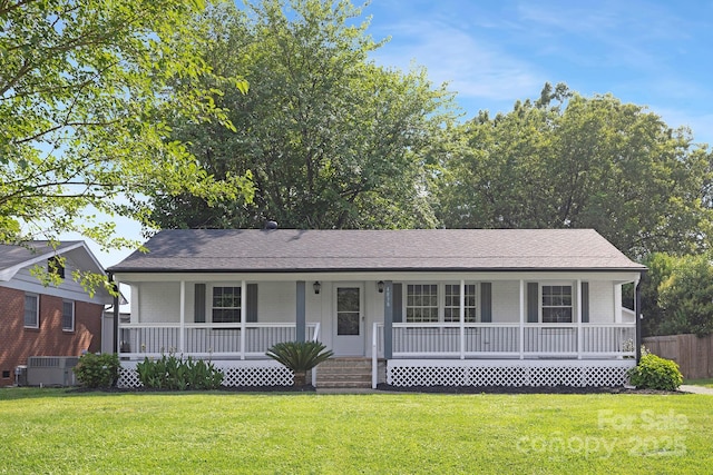 4838 Keats Ave, Charlotte, NC 28212 - view of front facade featuring covered porch, a front lawn, and brick siding
