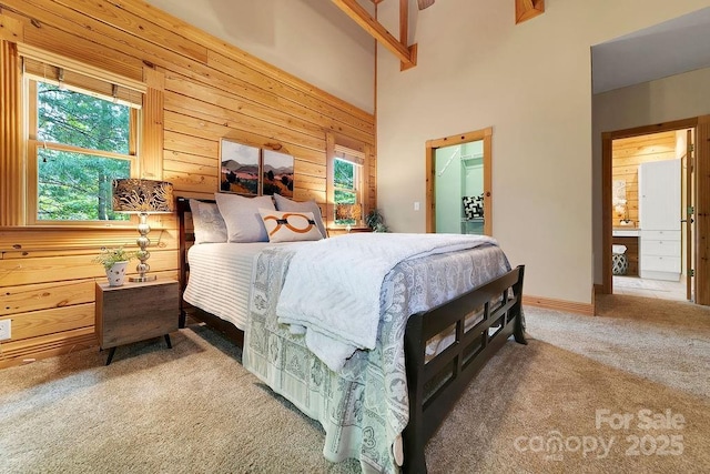 76 Isuhdavga Ct, Brevard, NC 28712 - bedroom featuring carpet flooring, multiple windows, wood walls, a walk in closet, and a high ceiling