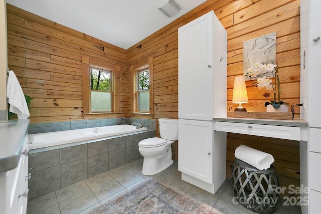 76 Isuhdavga Ct, Brevard, NC 28712 - bathroom with tile patterned flooring, toilet, a bath, and wood walls