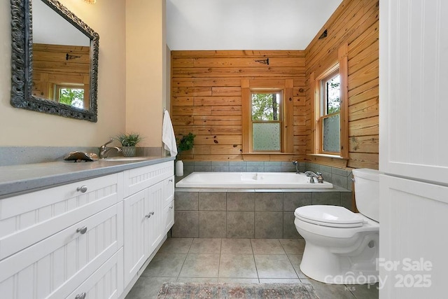 76 Isuhdavga Ct, Brevard, NC 28712 - full bathroom with toilet, tile patterned flooring, vanity, wood walls, and tiled tub