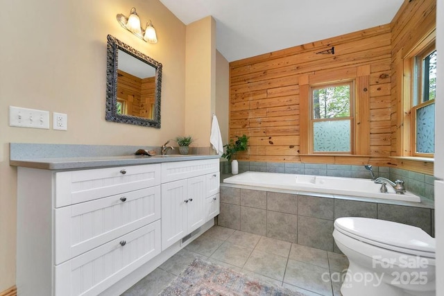76 Isuhdavga Ct, Brevard, NC 28712 - full bath with toilet, tile patterned floors, vanity, a garden tub, and wooden walls