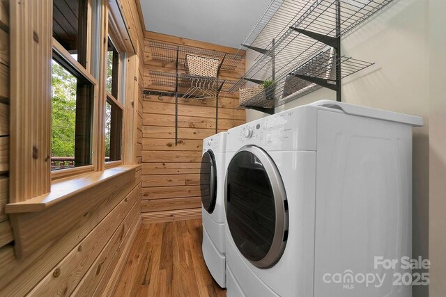 76 Isuhdavga Ct, Brevard, NC 28712 - laundry room with washer and clothes dryer, wood finished floors, and wooden walls