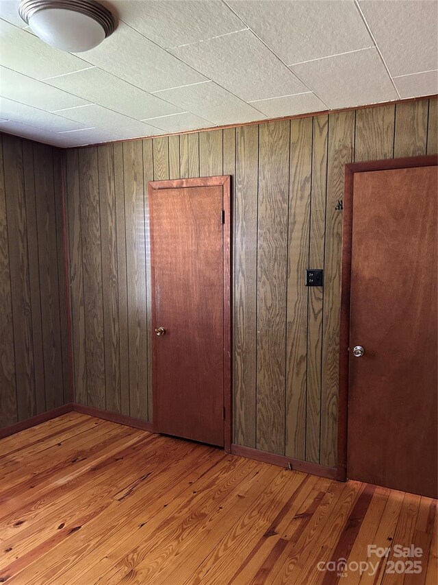 85 Oshea Ln, Waynesville, NC 28786 - empty room with wood walls and wood finished floors