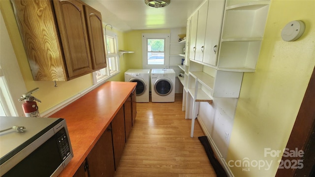 85 Oshea Ln, Waynesville, NC 28786 - washroom with washing machine and dryer and light wood finished floors