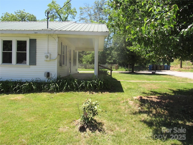 85 Oshea Ln, Waynesville, NC 28786 - view of side of home featuring a lawn and metal roof