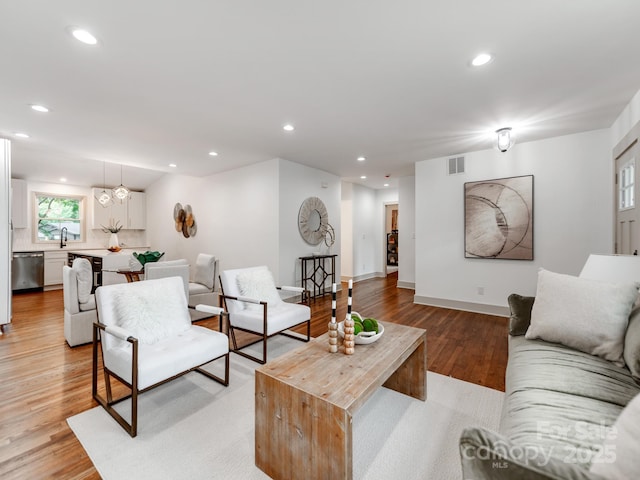 2114 Thurmond Pl, Charlotte, NC 28205 - living area with recessed lighting, light wood-type flooring, and baseboards