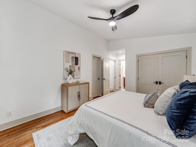 2114 Thurmond Pl, Charlotte, NC 28205 - bedroom with wood finished floors, baseboards, a ceiling fan, and a closet