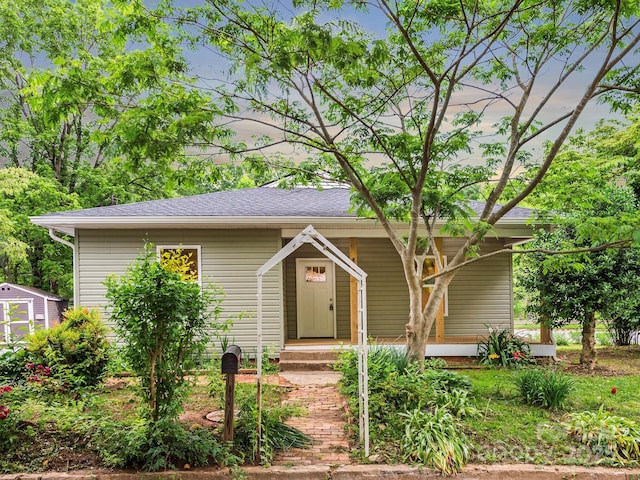 123 Edwards Ave, Swannanoa, NC 28778 - view of front of house with a porch and a shingled roof