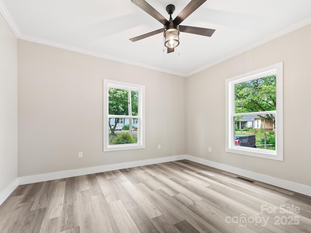 123 Edwards Ave, Swannanoa, NC 28778 - spare room with healthy amount of natural light, wood finished floors, ornamental molding, baseboards, and a ceiling fan