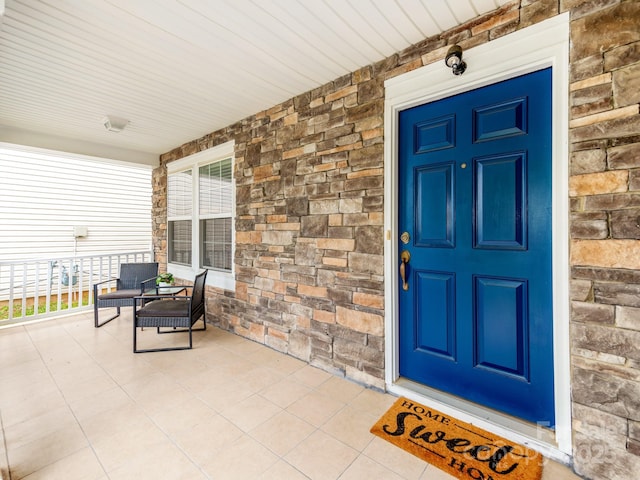 6532 Prosperity Commons Dr, Charlotte, NC 28269 - property entrance with covered porch and stone siding