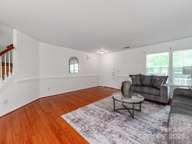 6532 Prosperity Commons Dr, Charlotte, NC 28269 - living room featuring wood finished floors, plenty of natural light, baseboards, and stairs