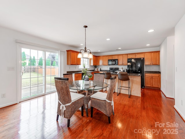 6532 Prosperity Commons Dr, Charlotte, NC 28269 - dining space with wood finished floors, recessed lighting, baseboards, and a chandelier