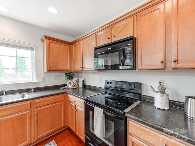 6532 Prosperity Commons Dr, Charlotte, NC 28269 - kitchen with black appliances, a sink, dark countertops, recessed lighting, and dark wood-style floors