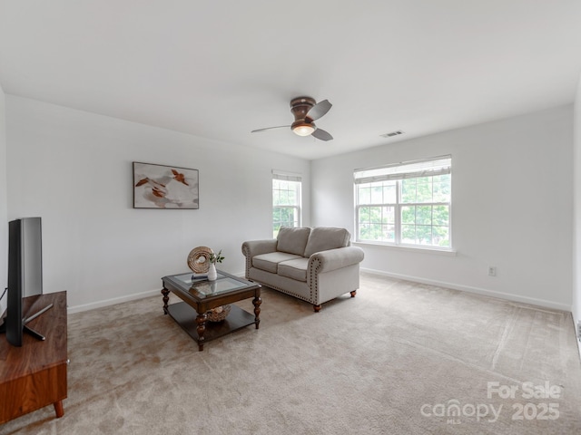 6532 Prosperity Commons Dr, Charlotte, NC 28269 - living area with a ceiling fan, baseboards, and carpet flooring