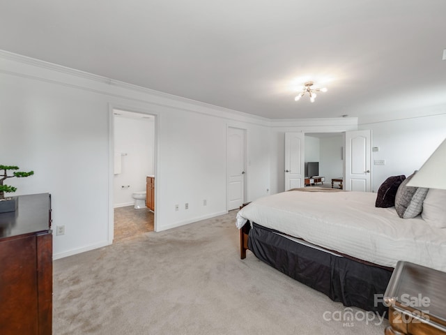 6532 Prosperity Commons Dr, Charlotte, NC 28269 - bedroom featuring light carpet, baseboards, crown molding, and ensuite bathroom