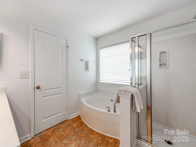 6532 Prosperity Commons Dr, Charlotte, NC 28269 - bathroom with a shower stall, a bath, and baseboards