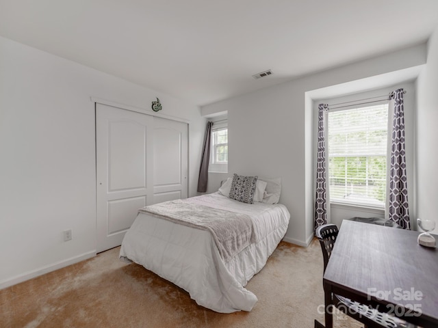 6532 Prosperity Commons Dr, Charlotte, NC 28269 - bedroom featuring light colored carpet, baseboards, and a closet