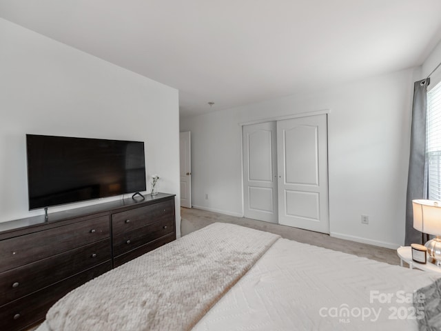 6532 Prosperity Commons Dr, Charlotte, NC 28269 - bedroom with baseboards, a closet, and carpet