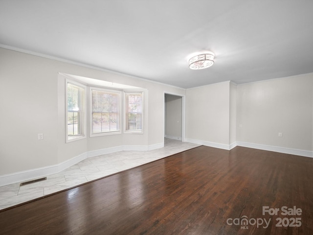322 Peachtree St, Albemarle, NC 28001 - unfurnished living room featuring wood finished floors and crown molding