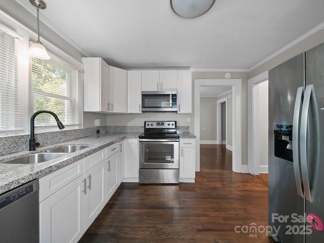 322 Peachtree St, Albemarle, NC 28001 - kitchen with stainless steel appliances, ornamental molding, dark wood-type flooring, white cabinets, and light stone countertops