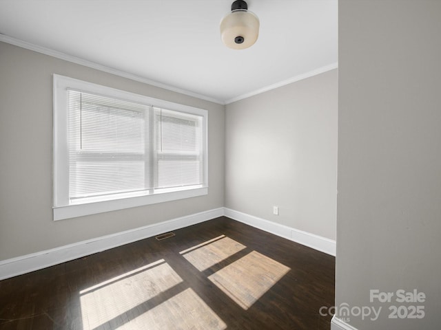 322 Peachtree St, Albemarle, NC 28001 - unfurnished room featuring ornamental molding and dark wood-style flooring