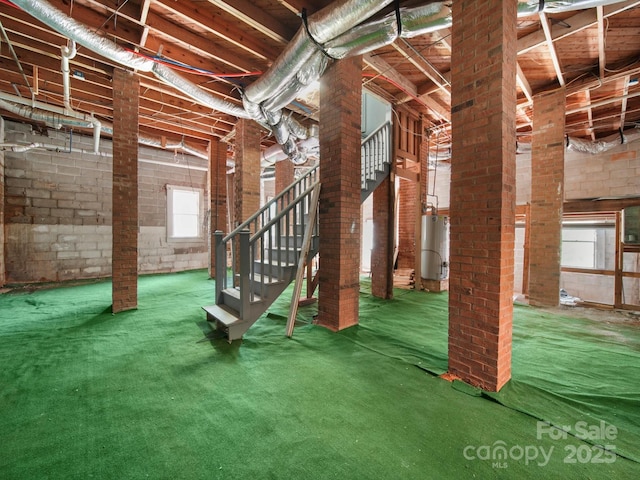 322 Peachtree St, Albemarle, NC 28001 - basement with water heater, stairway, and carpet floors