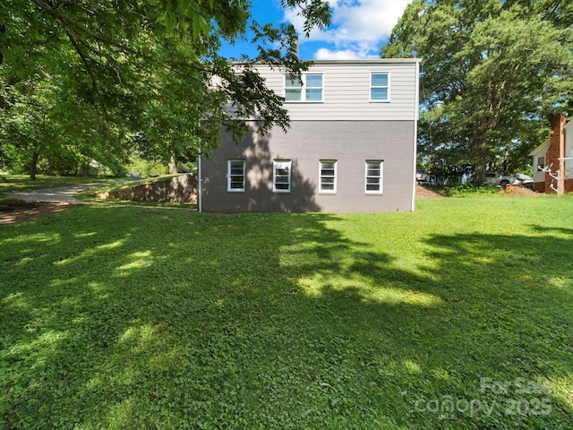 322 Peachtree St, Albemarle, NC 28001 - back of house with a lawn