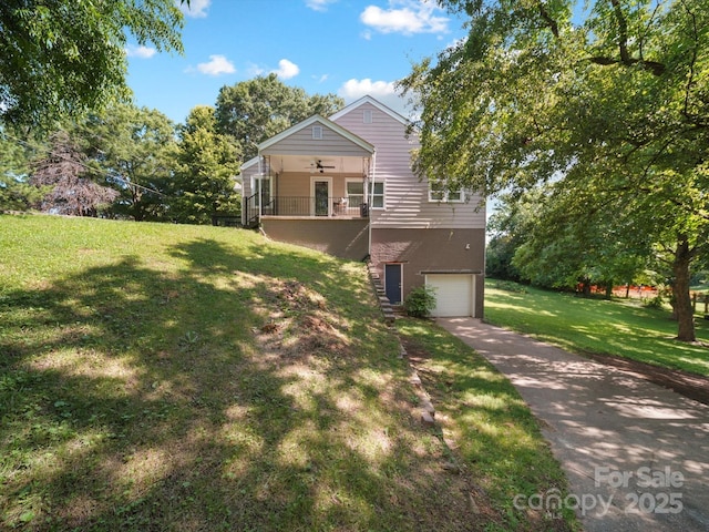 322 Peachtree St, Albemarle, NC 28001 - view of front of house featuring ceiling fan, a garage, a front lawn, driveway, and stairs
