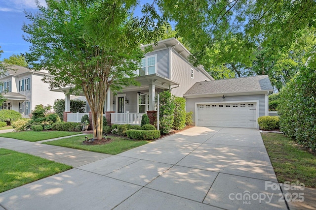 16909 Red Cow Rd, Charlotte, NC 28277 - traditional style home featuring covered porch, driveway, an attached garage, and a front lawn