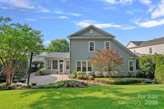 16909 Red Cow Rd, Charlotte, NC 28277 - back of property featuring a sunroom, a lawn, and a patio area