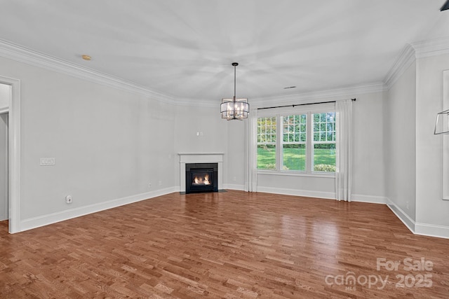 16909 Red Cow Rd, Charlotte, NC 28277 - unfurnished living room with wood finished floors, a chandelier, a fireplace with flush hearth, and ornamental molding