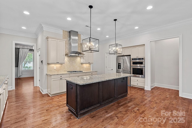 16909 Red Cow Rd, Charlotte, NC 28277 - kitchen with wall chimney exhaust hood, appliances with stainless steel finishes, a kitchen island, backsplash, and ornamental molding