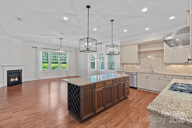 16909 Red Cow Rd, Charlotte, NC 28277 - kitchen featuring wall chimney exhaust hood, stainless steel appliances, light wood finished floors, open shelves, and ornamental molding