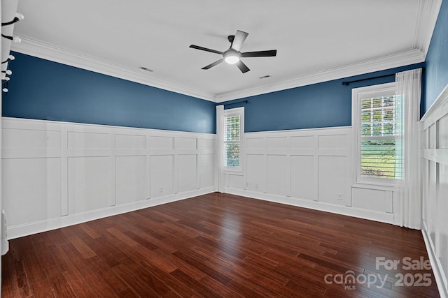 16909 Red Cow Rd, Charlotte, NC 28277 - unfurnished room featuring a decorative wall, a ceiling fan, wood finished floors, crown molding, and wainscoting