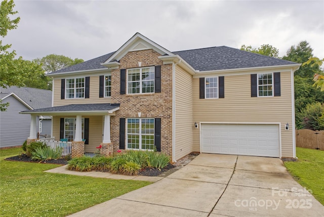 4001 Brook Valley Run, Monroe, NC 28110 - view of front facade featuring a porch, driveway, an attached garage, and brick siding
