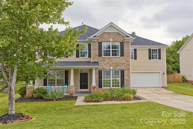 4001 Brook Valley Run, Monroe, NC 28110 - view of front facade with covered porch, driveway, a garage, and brick siding