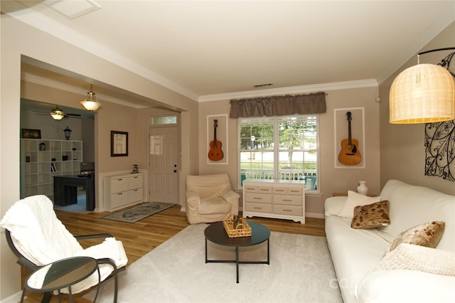 4001 Brook Valley Run, Monroe, NC 28110 - living area featuring wood finished floors, crown molding, and baseboards