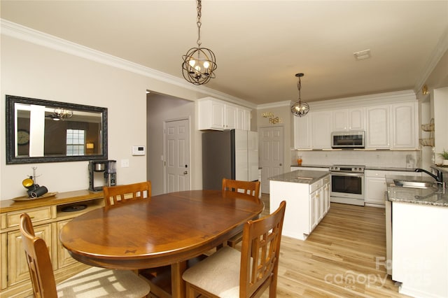 4001 Brook Valley Run, Monroe, NC 28110 - dining room featuring crown molding and light wood-style floors