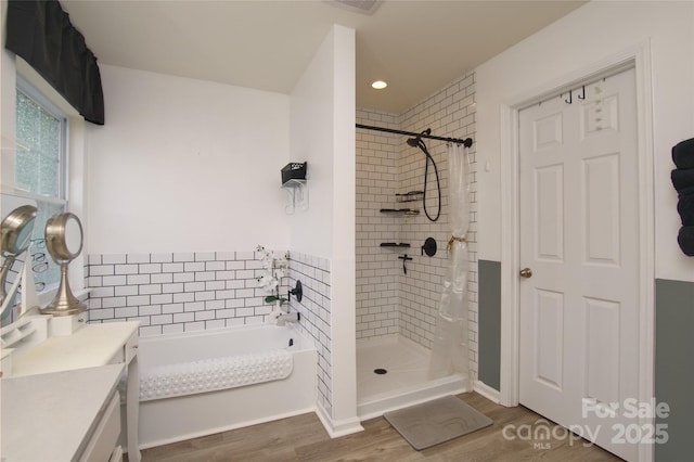 4001 Brook Valley Run, Monroe, NC 28110 - full bath featuring wood finished floors, a bath, tiled shower, vanity, and recessed lighting