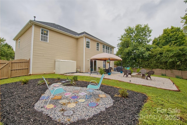 4001 Brook Valley Run, Monroe, NC 28110 - rear view of property with a patio area, a fire pit, and a fenced backyard
