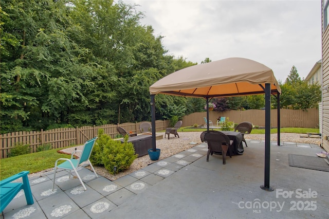4001 Brook Valley Run, Monroe, NC 28110 - fenced backyard with a gazebo, a patio area, and an outdoor fire pit