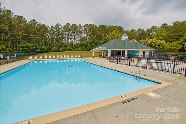 4001 Brook Valley Run, Monroe, NC 28110 - community pool with a patio area and view of scattered trees