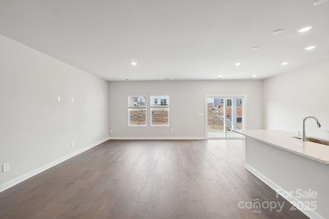 2119 Rolling Hills Ct, Stanley, NC 28164 - unfurnished living room with dark wood-style flooring and recessed lighting