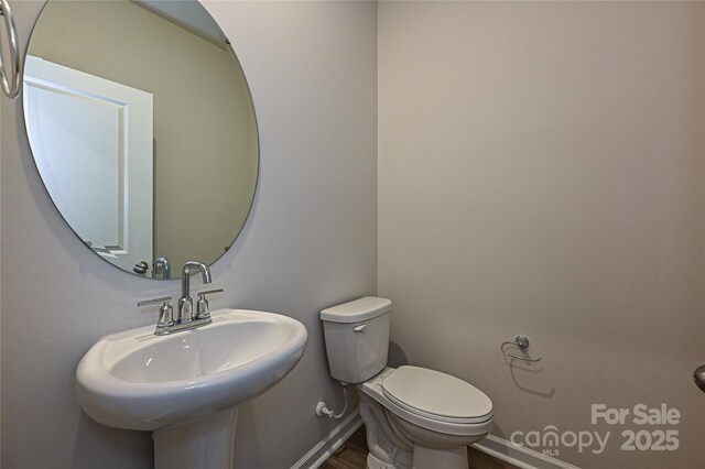 2123 Rolling Hills Ct, Stanley, NC 28164 - bathroom featuring toilet and wood finished floors