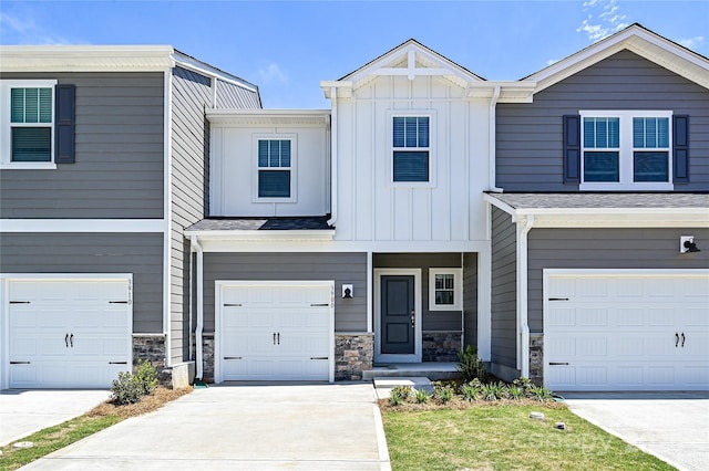 6110 Starview Ter, Charlotte, NC 28216 - view of property featuring an attached garage, board and batten siding, and stone siding