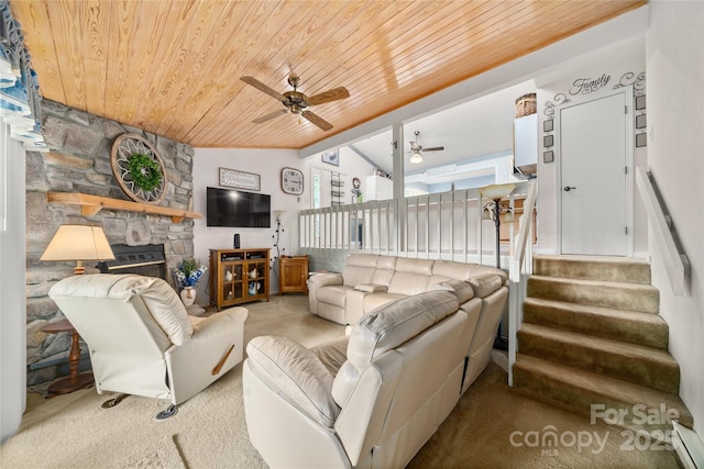 131 Apple Blossom Ln, Maggie Valley, NC 28751 - living room with wood ceiling, a ceiling fan, carpet, a stone fireplace, and stairs