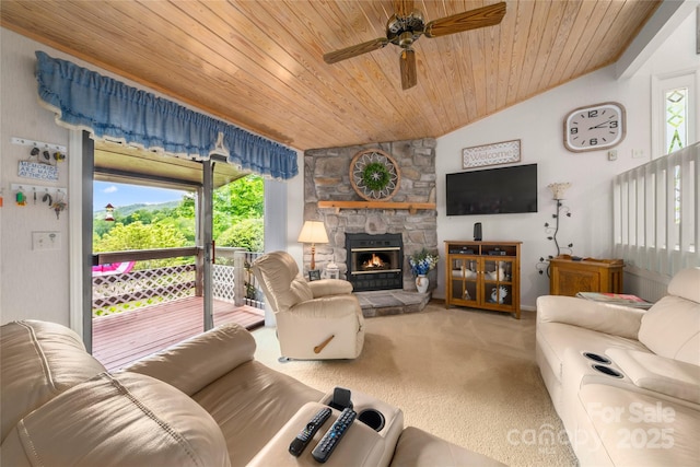 131 Apple Blossom Ln, Maggie Valley, NC 28751 - carpeted living area featuring vaulted ceiling, a ceiling fan, wooden ceiling, and a fireplace