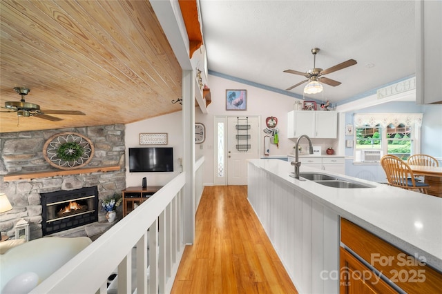 131 Apple Blossom Ln, Maggie Valley, NC 28751 - kitchen featuring ceiling fan, vaulted ceiling, a sink, light wood-style floors, and open floor plan