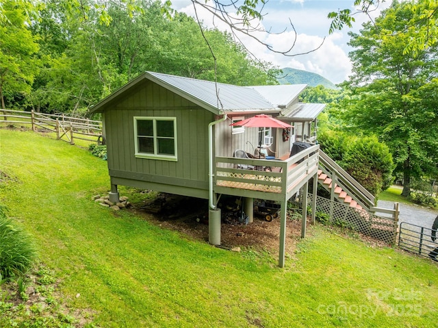 131 Apple Blossom Ln, Maggie Valley, NC 28751 - back of house with board and batten siding, a wooden deck, and metal roof